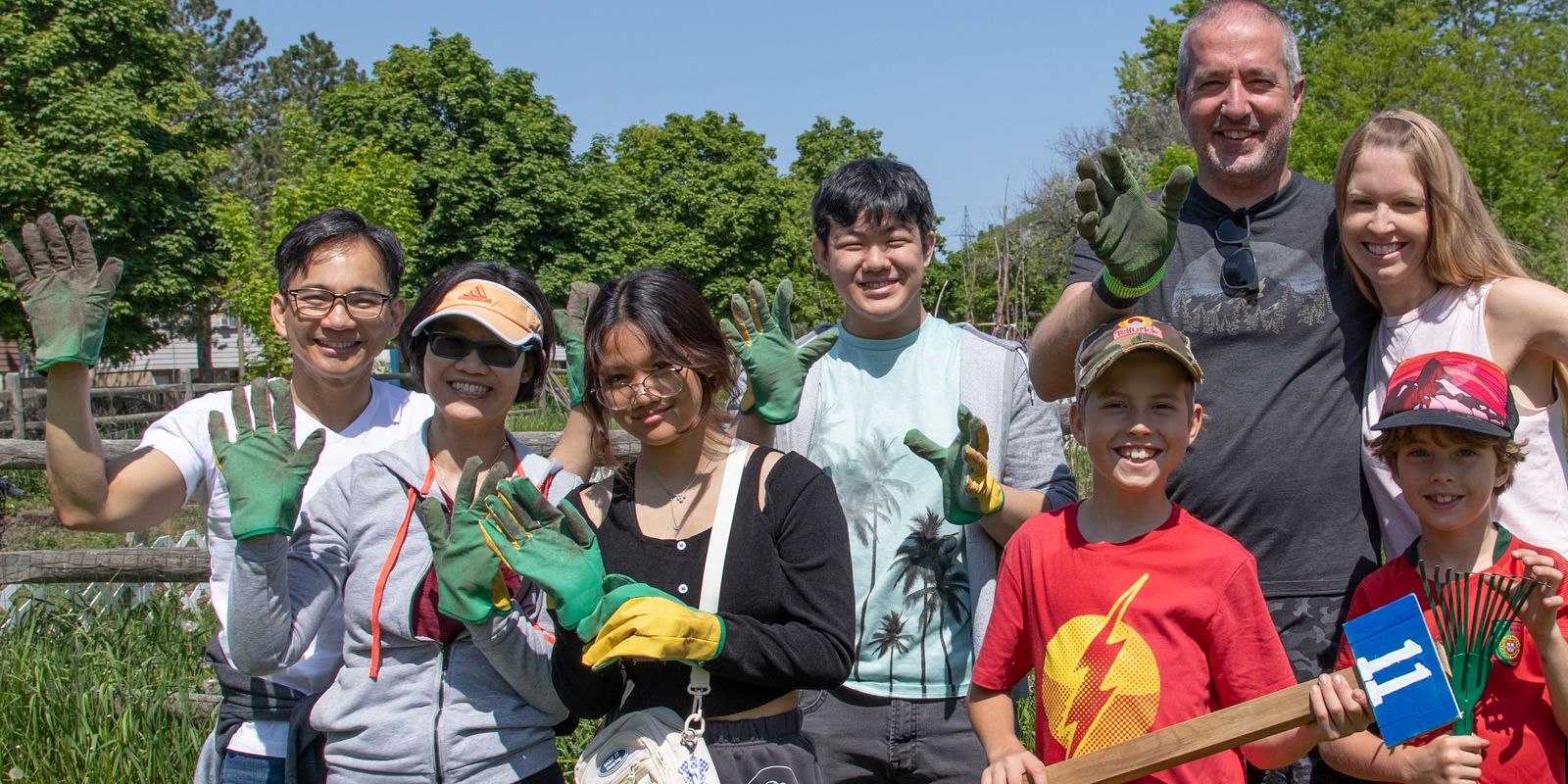 A group of volunteers smiling in a garden